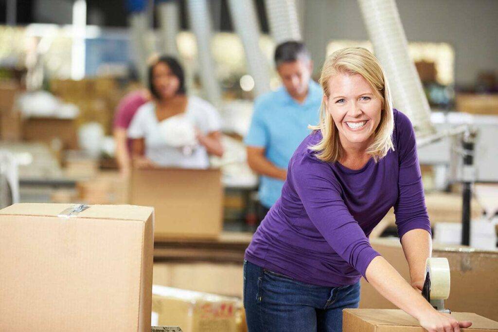 woman working in a fulfillment warehouse